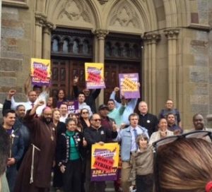 Clergy stand with the janitors and members of SEIU 32BJ