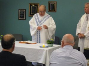 Fr. Pat Sullivan administers mass